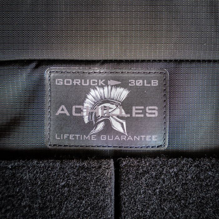 Close-up of the "GORUCK 30LB ACHILLES LIFETIME GUARANTEE" patch with a Spartan helmet on the Achilles | Men's Weighted Vest.