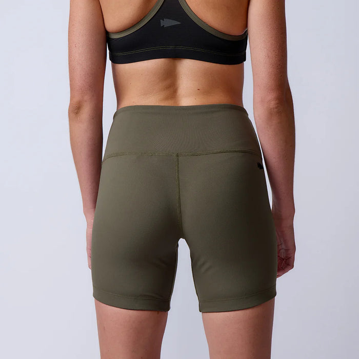 Back view of woman wearing GORUCK olive green rucking shorts and black sports bra