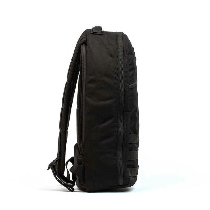 GORUCK black rucksack side view, rugged tactical backpack with padded straps, isolated on white