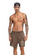 Brown shorts with embroidered sun, palm tree, and script embroidery details on front