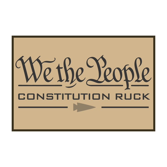 Celebrate American heritage with the Constitution Ruck: a tan sign displaying “We the People” in elegant script—honoring the United States Constitution—and “CONSTITUTION RUCK” in bold lettering beneath an arrow, capturing the enduring spirit of the Bill of Rights.