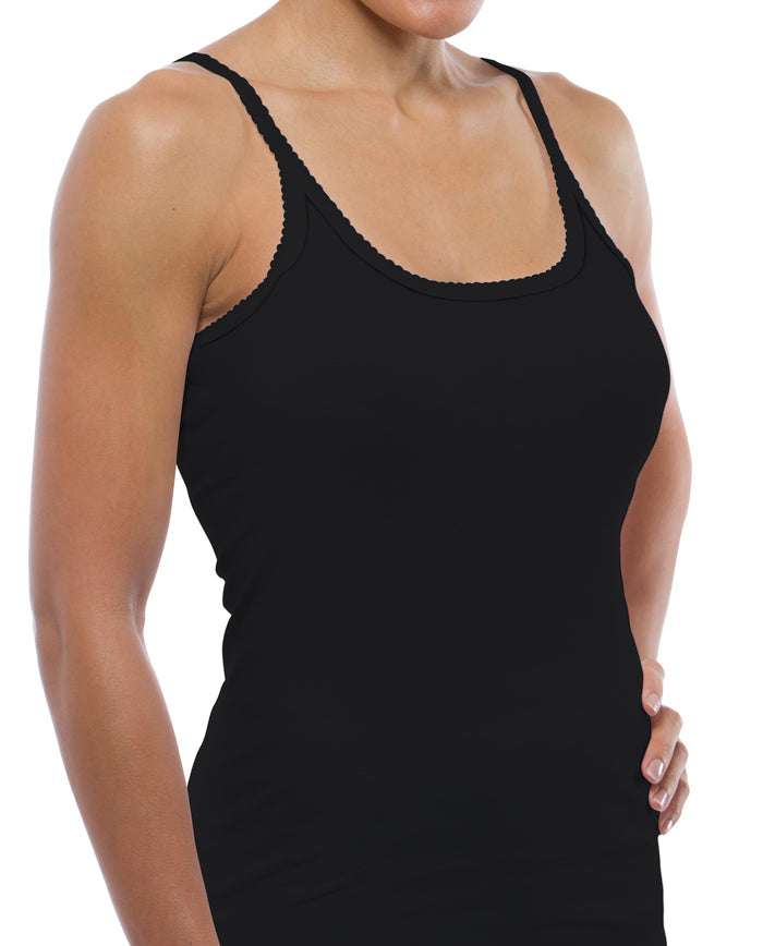A woman models the black Cozy Cotton Camisole (Style 1500) by Teri Lingerie against a white background, her right hand on her hip and her head partially out of frame.