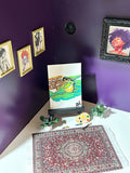 Don't Look At Me miniature frog artwork displayed in an art room