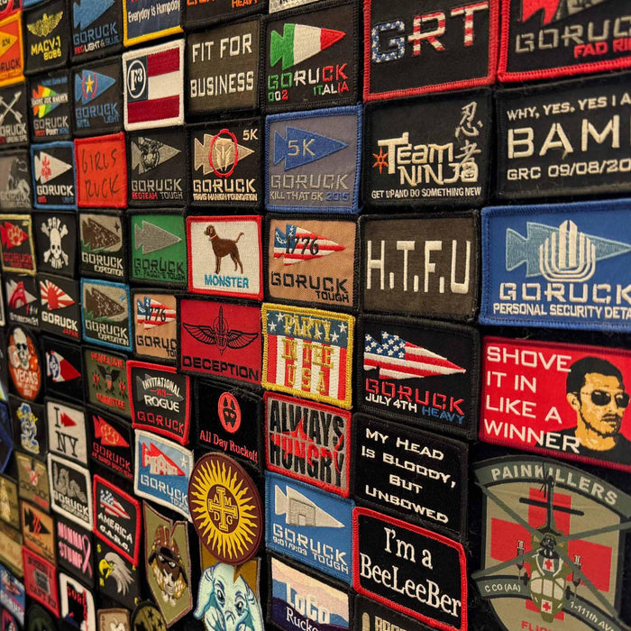 GORUCK embroidered patches wall display featuring rucking event and club badges