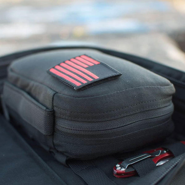 GORUCK black MOLLE pouch with red striped patch attached to ruck backpack