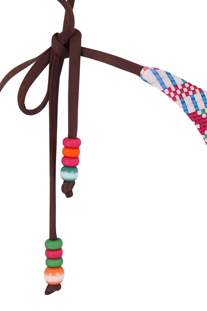 Karmine bikini bottom with brown tie straps, colorful beaded accents in pink, orange and green, and multicolor checkered placement print