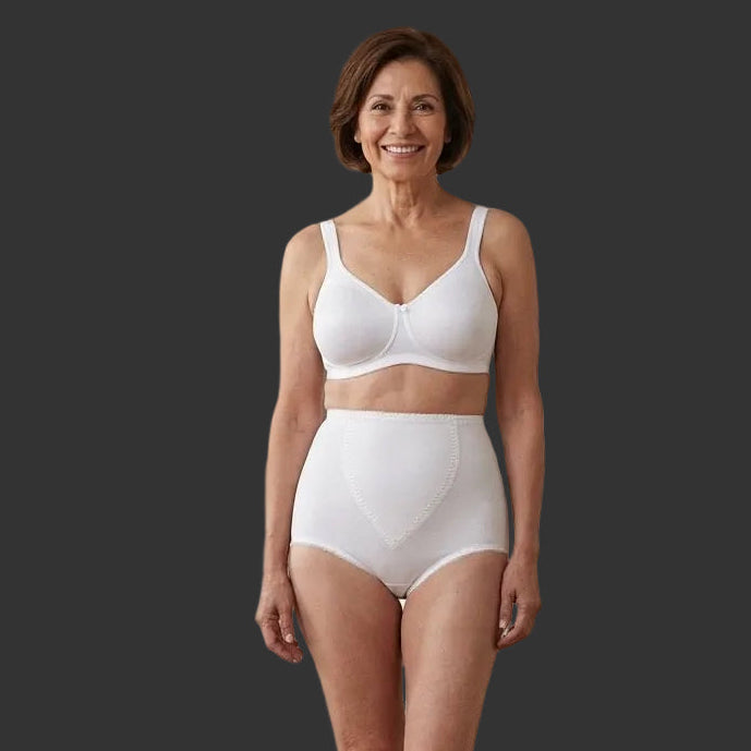 Woman wearing a white bra and 751 Kathryn on a dark background