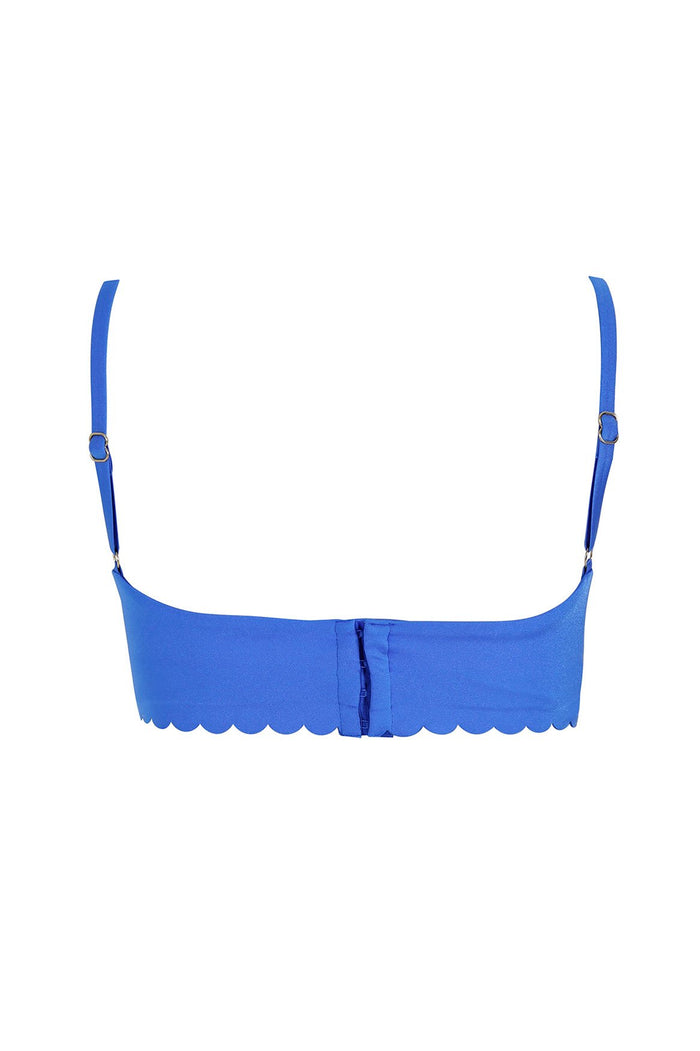 Blue bikini top with adjustable straps, underwire support, and scalloped trim along the band
