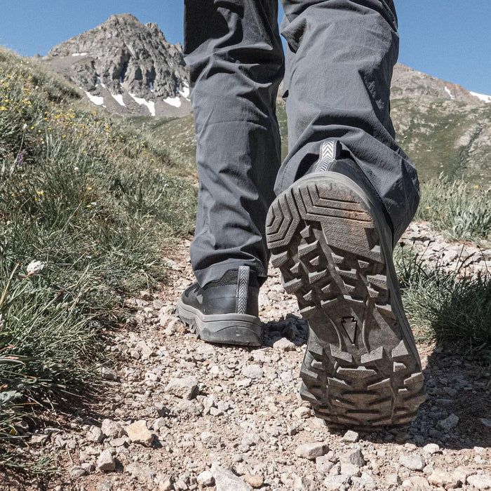 GORUCK rugged trail shoe outsole on rocky mountain path outdoors