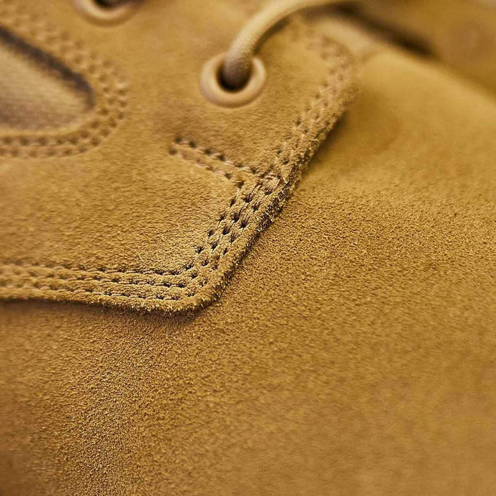 Close-up of rugged tan suede GORUCK rucking boot with detailed stitching and lace eyelet.