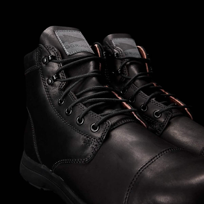 GORUCK black leather rucking boots with rugged laces on a black background