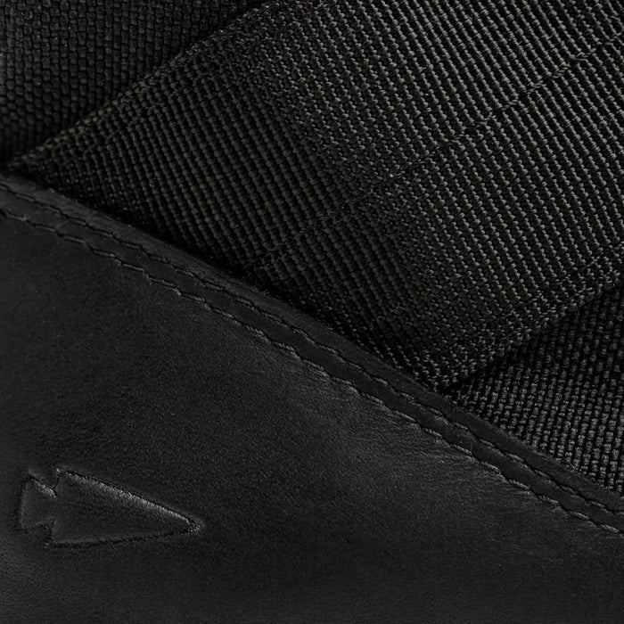 Close-up of GORUCK rucking shoe with black leather and nylon material, arrowhead logo detail