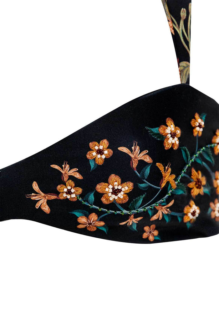 Black bikini top with handmade embroidered orange flowers, teal leaves, and beaded green vine details