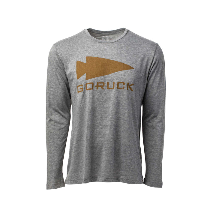 The Men's GORUCK Spearhead Long Sleeve - Tri-BlendX is a gray shirt with a brown spearhead graphic and "GORUCK" text on the front.