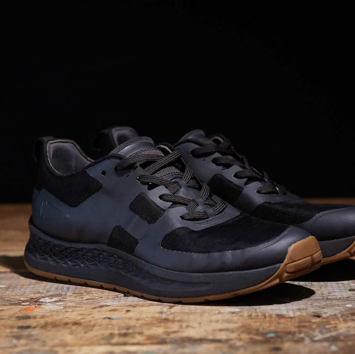 GORUCK black rucking shoes with gum sole on wooden surface, durable training footwear