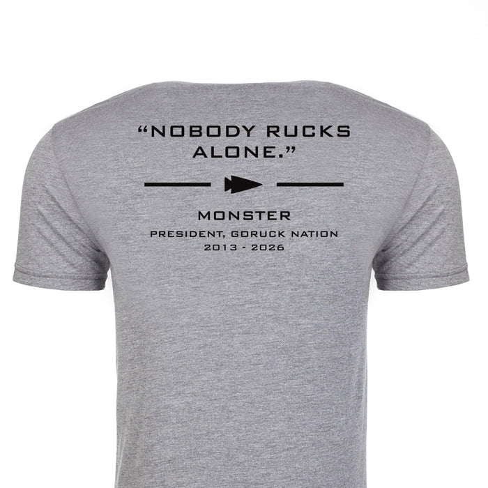 Gray Monster Forever Tee (PREORDER) – Back features black “NOBODY RUCKS ALONE.” text and additional details beneath a small arrow graphic.