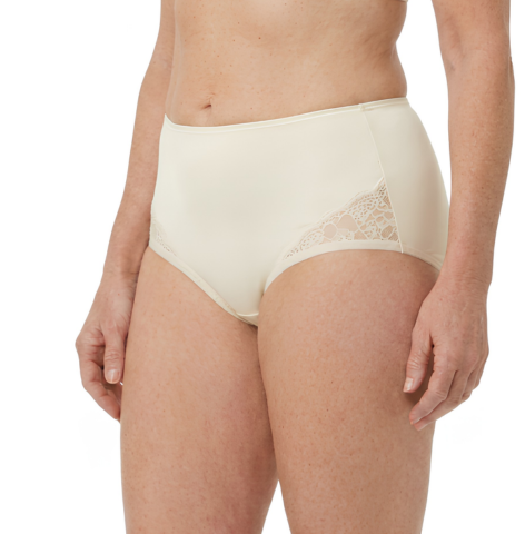 A woman models Teri Lingerie's Nylon and Lace Brief Panty (Style M108/Beatrice) 3 Pack in Ivory—high-waisted with lace hip details—shown from mid-torso to upper thighs against a white background.