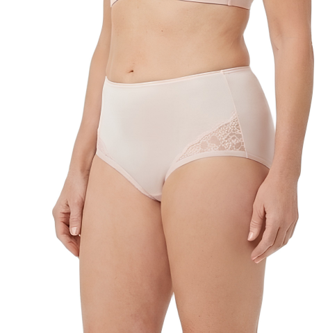 A woman models Teri Lingerie's NYLON GUSSET Nylon and Lace Brief Panty (Style M108/Beatrice) in light pink, featuring high-waist, full coverage, and lace side details; her midsection and upper thighs are shown against a plain background.