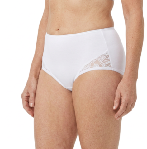 A person models Teri Lingerie’s Nylon and Lace Brief Panty (Style M108/Beatrice) 3 Pack in White, featuring high-waisted nylon and lace sides, shown from mid-torso to upper thighs against a plain background.