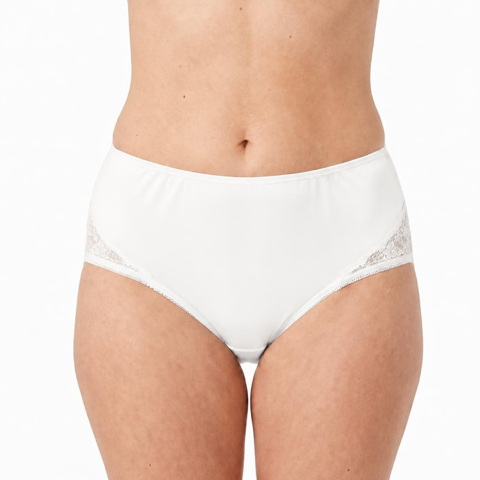 A model wears Teri Lingerie’s M108 Beatrice nylon and lace brief in White, featuring full coverage, lace side detailing, and a sewn-in 100% cotton liner; sold as a solid White 3-pack.