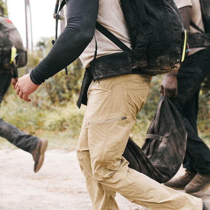GORUCK padded hip belt in use outdoors, shown on person rucking with loaded backpack