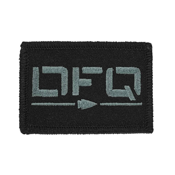 GORUCK black embroidered patch with stylized grey lettering and arrow design
