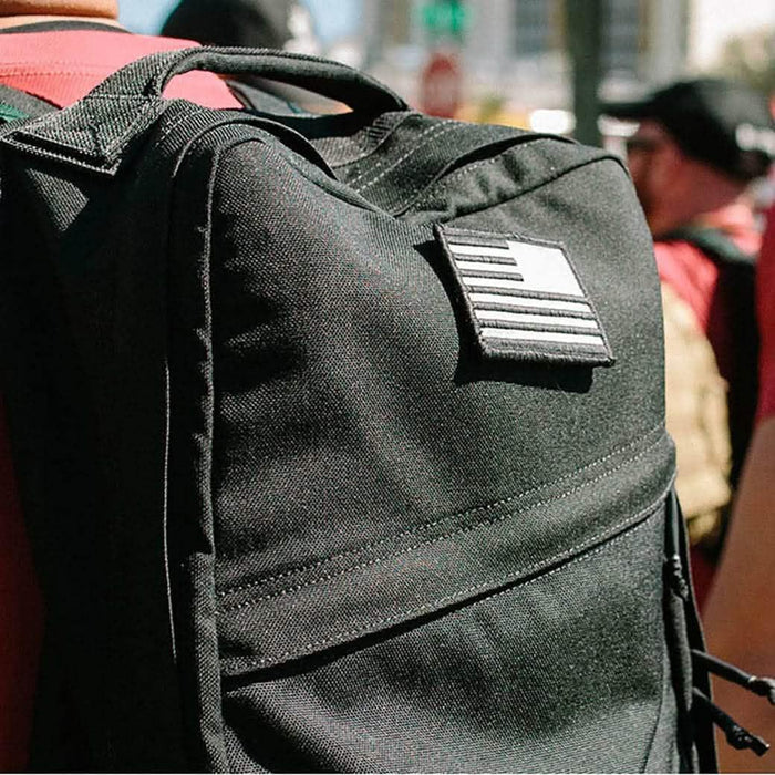 GORUCK black rucksack backpack with American flag patch during outdoor rucking event