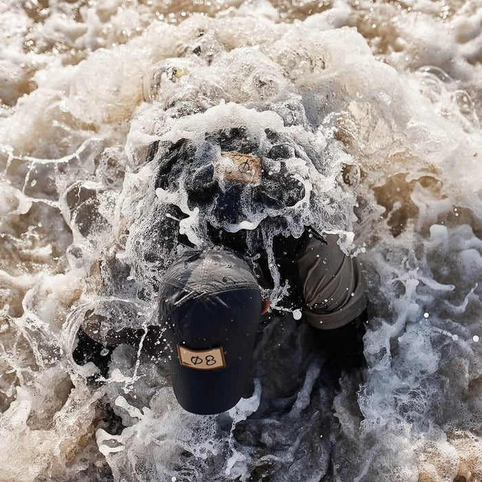 GORUCK tactical cap and gear in ocean surf during rucking training exercise