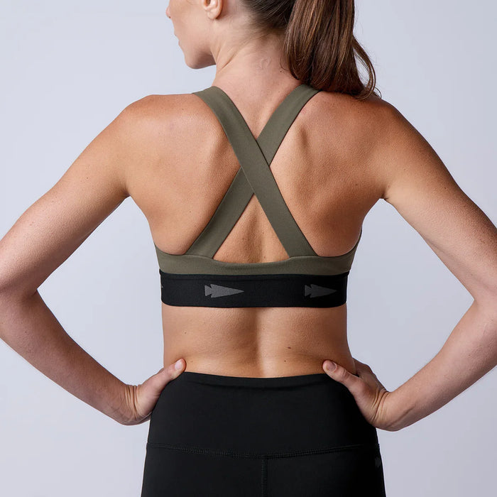 Woman wearing GORUCK sports bra with cross-back straps, designed for rucking fitness