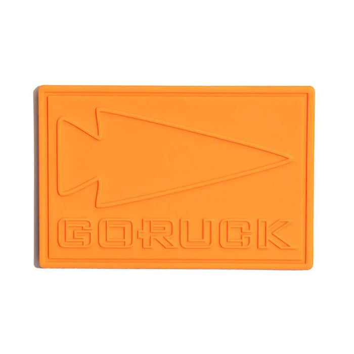 GORUCK orange PVC patch with arrowhead logo and embossed lettering on white background