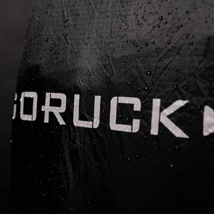 GORUCK black rucking gear with water droplets, rugged water-resistant fabric
