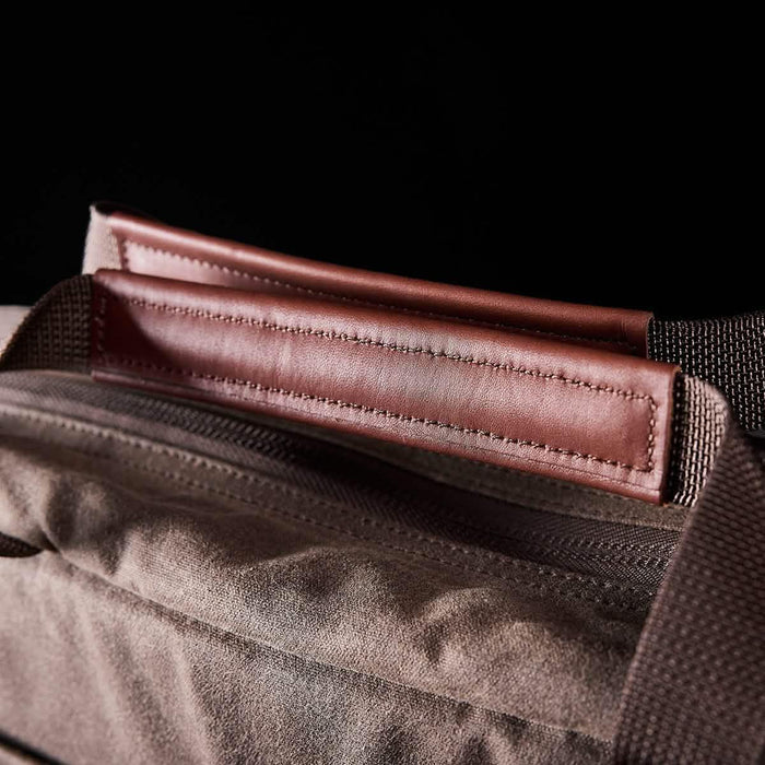 GORUCK brown rucksack with durable leather handle and rugged fabric, close-up view