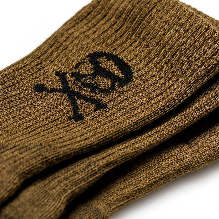 GORUCK coyote brown merino wool crew socks with black skull and crossbones logo