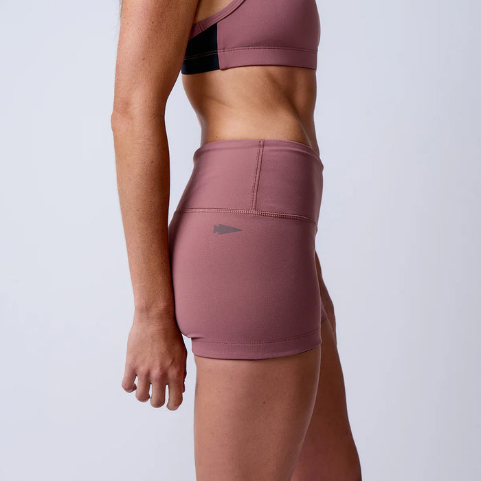 GORUCK women's mauve athletic shorts and sports bra, side view studio shot