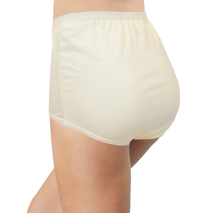 A person wears The Classic Betsy (M100) high waist cotton brief by Teri Lingerie, shown from the waist down and turned slightly to the side against a plain white background.