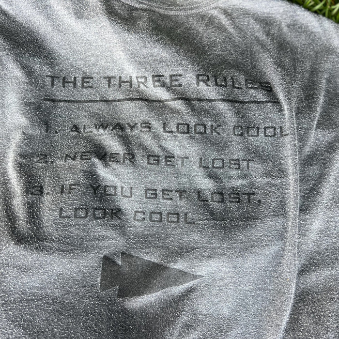 The Three Rules Tee - Unisex Tri-BlendX: a gray GORUCK shirt featuring the printed text, "The Three Rules: 1. Always look cool, 2. Never get lost, 3. If you get lost, look cool.