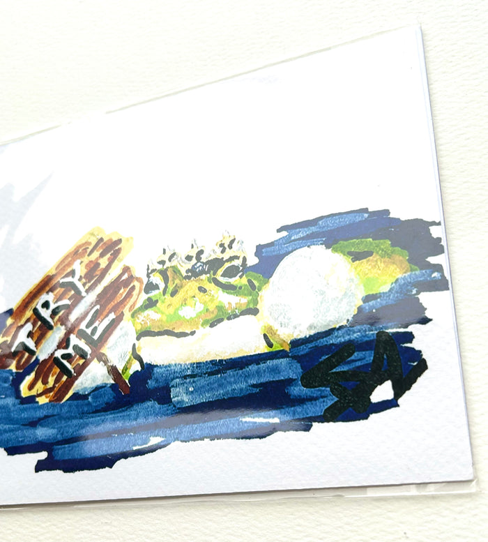 Angled close-up of Try Me 5x7 frog art print showing the crowned frog, sign, and blue water details