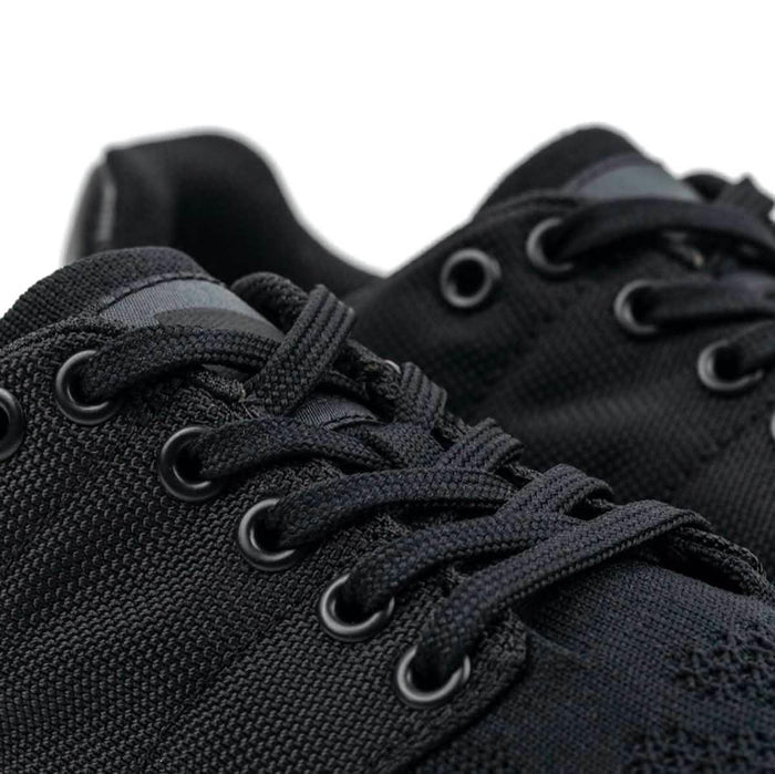 Close-up of GORUCK black reflective rucking shoes with durable laces and rugged material