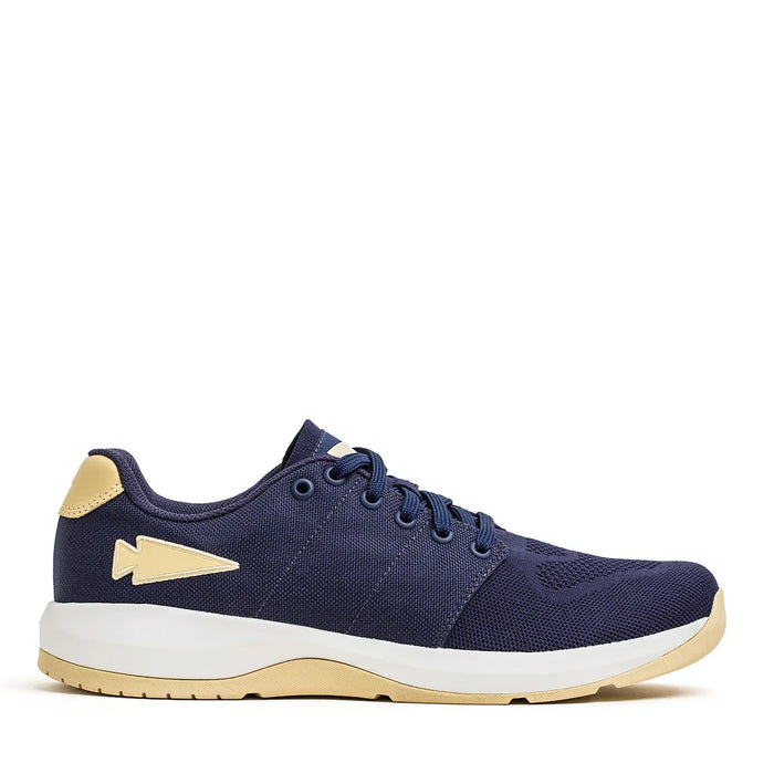 GORUCK navy blue ballistic trainer shoe with gold accents and white sole, side view