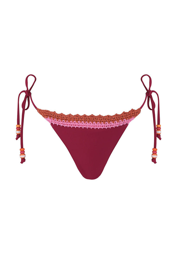 Burgundy tie-side bikini bottom with pink and coral crochet trim along waistband and beaded tie accents